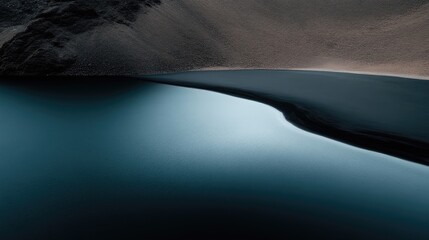 Serene Mountain Lake Reflecting Dark Cliffs