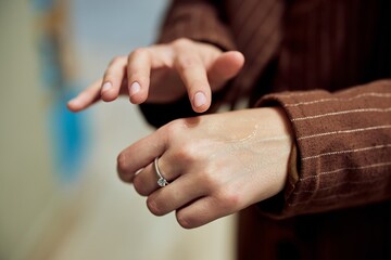 Applying Moisturizing Lotion to Hands for Skincare and Hydration