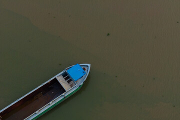 Boat on Murky Water, Aerial View