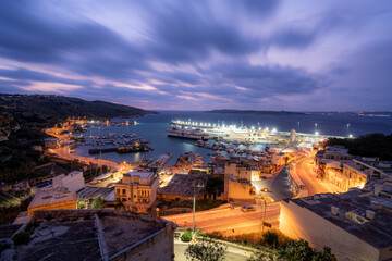 Long exposure of the Gozo Ferry Mgarr Harbour in Gozo before just before sunrise