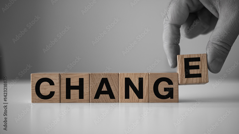 Poster wooden cubes spelling change, a hand adding the final 'e', symbolizing transformation and progress, 