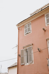 Charming Pink House with Shuttered Windows