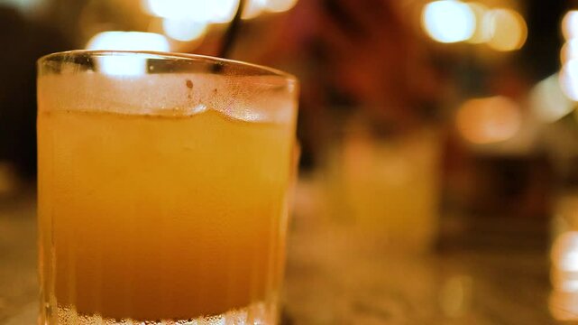 Vibrant Cocktail in a Lively Bar Setting