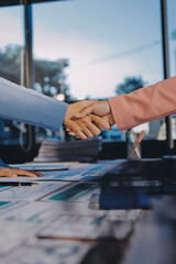 Business success. Business people shaking hands agreement confirmed in the investment business.
