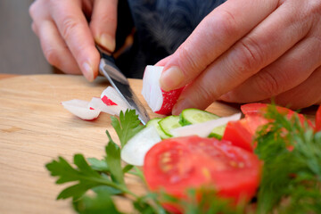Chopping veggies for a fresh summer salad