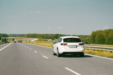 European combi car on a long empty road