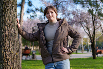 portrait of a teenage girl in a spring park