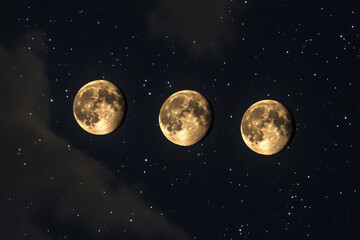 Three full moons shining brightly in a starry night sky