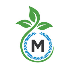 Fototapeta premium Eco Logo On Letter M With Green Leaf and Ribbon Symbol