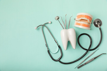 Dentist tools on a blue background. Dentist Concept.Teethcare, dental health concept. Means to care...
