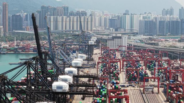 Modern container terminal managing logistics and freight transportation in hong kong, showcasing import and export operations within a dynamic global trade environment. Trade wars, tariffs