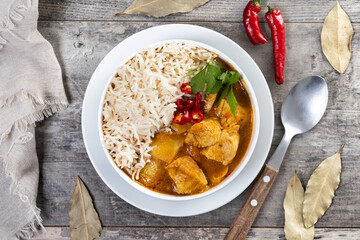 Massaman curry on wooden table. Traditional Thai food recipe
