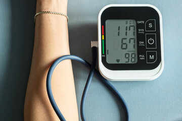 Man check blood pressure monitor and heart rate monitor with digital pressure gauge. Health care...
