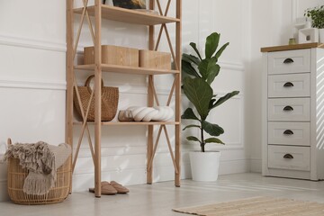 Stylish shelving unit with decor in room
