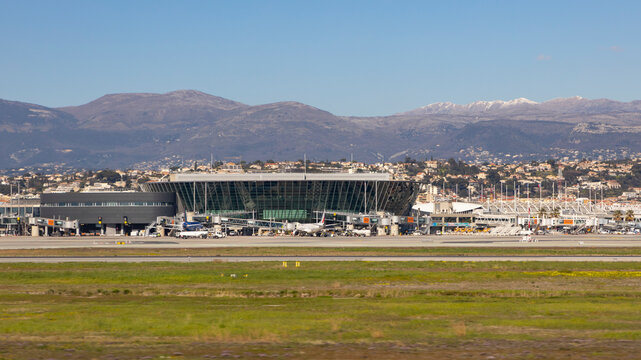 Nice, France - March 16, 2025: Terminal 2 of Nice Airport in France with airplanes at the gates