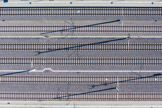Multi-lane railway track seen from above, aerial view top down