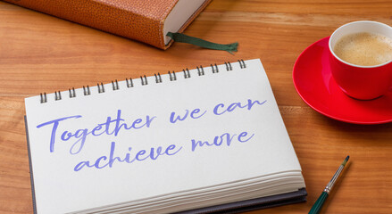  Notepad on a desk - Together we can achieve more