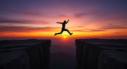 Silhouette of a Man Jumping Over a Gap Between Cliffs at Sunset
