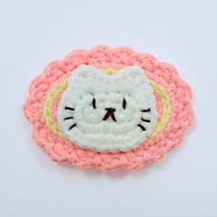 cat crochet hairclip on white background