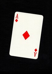 Playing card in the suit of diamonds isolated on a black background.