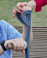 A hand supports an old man, support in old age