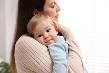 Mother with her cute little baby at home