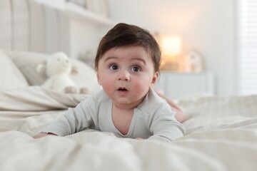 Bedtime. Cute little baby on bed at home