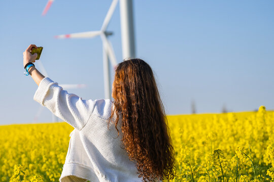 Girl Taking a Selfie in the Mills and Canola Fields, Silivri Istanbul, Turkiye (Turkey)