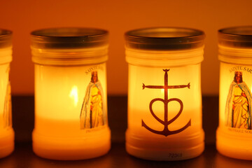 statue of saint sarah with tea lights and candles