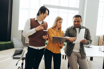 Marketing team analyzing data and discussing project strategy in office