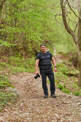 Photographer on spring forest trail