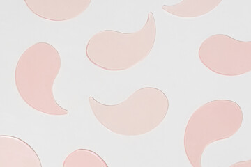 Pattern pink hydrogel patches on a white isolated background. A nourishing skincare essential that hydrates, revitalizes, and smooths under-eyes concept