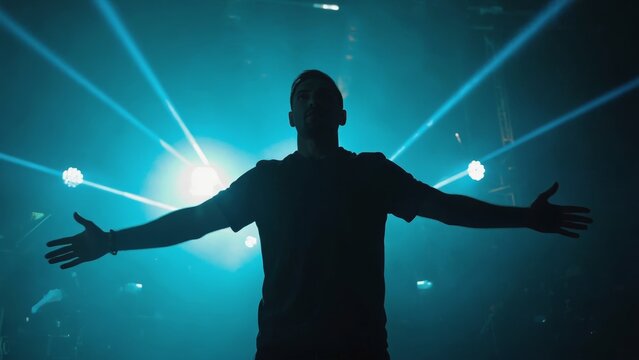 A performer passionately singing on stage in front of a crowd, under bright concert lights.