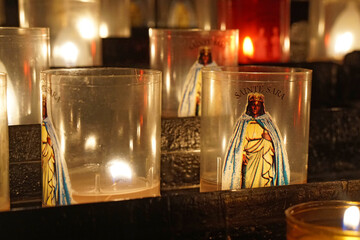 statue of saint sarah with tea lights and candles