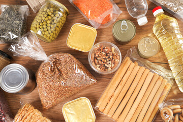 Different food products on wooden table, flat lay