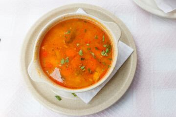Fish soup on a table in restaurant. Top view