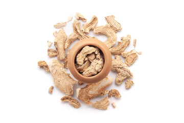 A mud pot filled with organic Ginger root (Zingiber officinale) or sonth is placed on a heap of ginger roots, isolated on a white background.