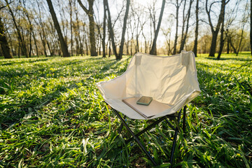 outdoor lounge chair with laptop and smartphone, outdoor work concept
