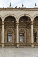 Showcase the alabaster mosque columns in Mohammed Ali's courtyard, capturing the Cairo citadel majesty. Perfect for designs focusing on historical Islamic landmarks.
