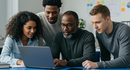 Diverse Team Collaboratively Reviews Laptop Screen