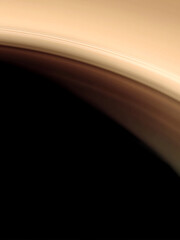 Abstract artwork inspired by the elegant silhouette of Saturn's rings against a dark planet. Features soft focus and smooth transitions between brown and black color bands.
