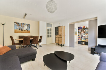 Stylish modern living room featuring contemporary furniture, elegant decor, and a cozy atmosphere ideal for relaxation and entertainment.