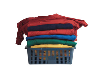 Wicker basket with a stack of colorful clothes on a white background