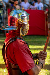 Roman legionary parading in a historical reenactment party event about ancient Rome.