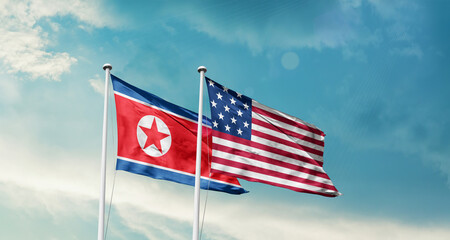 North Korea and America friendship flags are waving in the sky.Two country flag for agreement or deal. Korea USA national flag for comittment.