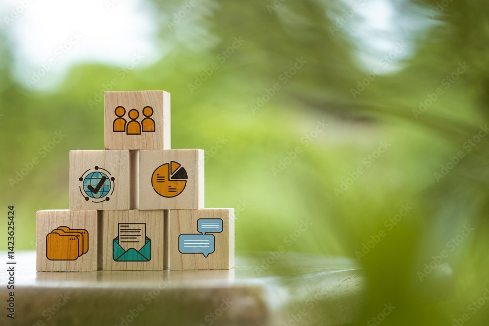 Poster stacked wooden blocks display various business and communication icons like charts, messages, teams,