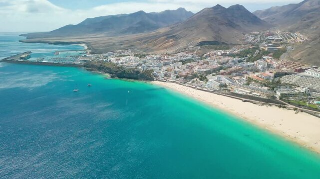 White sandy beach and blue water in Morro Jable, south of Fuerteventura, Canary islands
