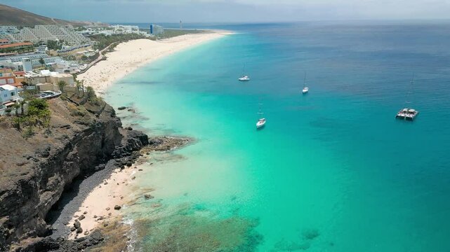 White sandy beach and blue water in Morro Jable, south of Fuerteventura, Canary islands