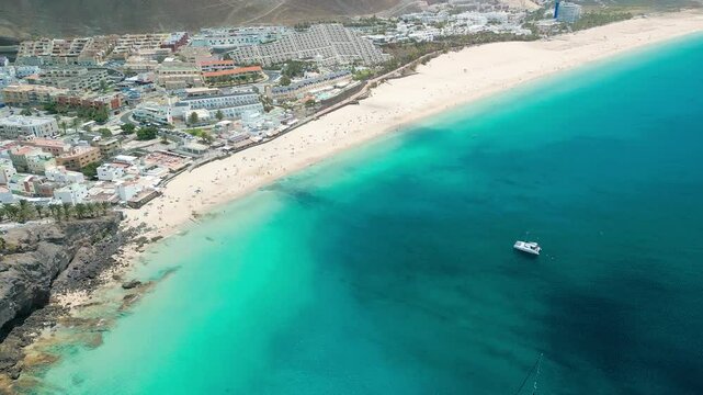 White sandy beach and blue water in Morro Jable, south of Fuerteventura, Canary islands