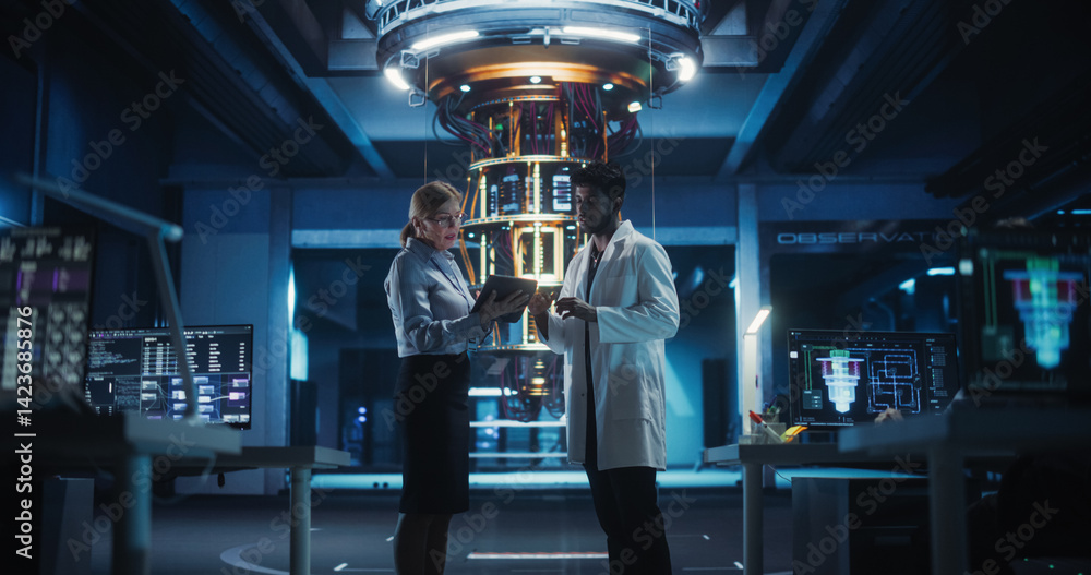 Poster portrait of engineers standing in a research center, using a tablet next to a powerful quantum proce